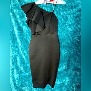 Short black dress with one shoulder.